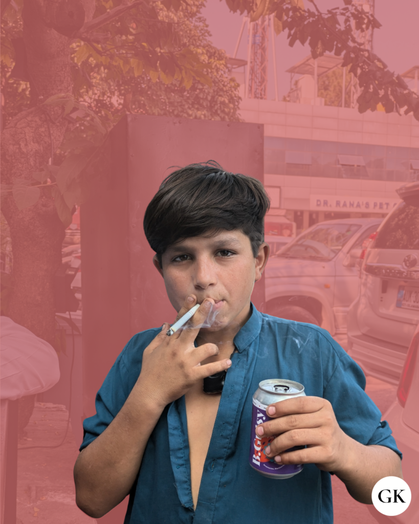 photo of an undocumented afghan child smoking a cigarette in shaheen market, islamabad
